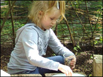 A young girl eating snails in the Dreaming Dome