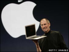 Apple CEO Steve Jobs holds the MacBook Air