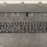 Ground Staff at R.A.F. Bassingbourne, 1940 to 1941. Les is on the 3rd row back, 2nd from the right. Note the windows are taped to prevent injury from bomb blast.