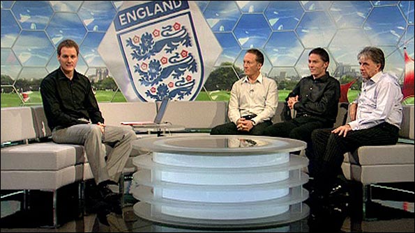 Dan Walker sports his Prince of Wales check trousers on the Focus sofa