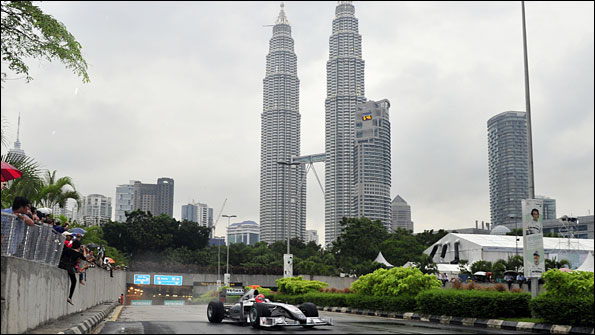 Michael Schumacher drives in front of the Petronas Towers