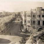 View of Benghazi with ship burning in the harbour.