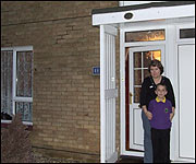 Sue Stainer and son Jack (10) outside their house