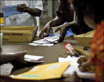 People sorting mail