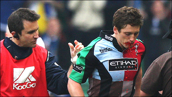 Former Quins physio Steph Brennan (left) gestures to Tom Williams as he leaves the field with the infamous fake blood streaming from his mouth