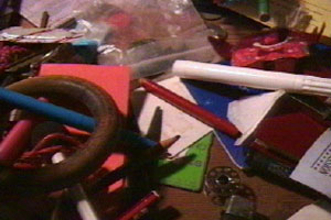 Chris is surrounded by clutter