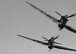 Three of 1 Squadron's Hurricanes, making a mock attack on a Fairey Battle light bomber