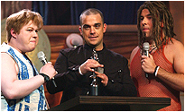 Robbie collecting his award from Matt Lucas and David Walliams