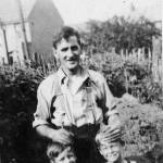 Raymond (holding the apple) and his brother, Graham, helping their father install the air raid shelter in Nelson Road, Northfleet