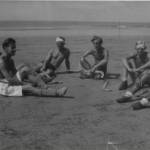 Doug Dawes (far right) with hockey comrades, late 1945, on the beach at Juhu, Bombay