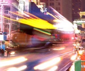 A busy city street at night