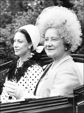 The Queen Mother Elizabeth and Princess Margaret arrive in an open carriage in 1967 at Ascot.