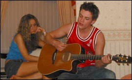 Gary plays Carly a tune