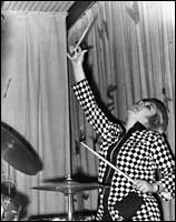 Woman playing drums 200