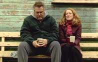 Tommy and Eileen have a quiet moment.