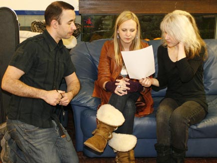 Hannah Jackson and Hayley Smith rehearse the lines for their duet under the guidance of composer James Atherton