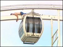 Man climbs the Belfast Wheel