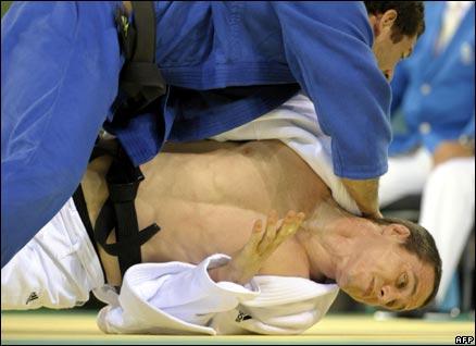 Euan Burton's medal hopes were ended by Brazilian star Tiago Camilo