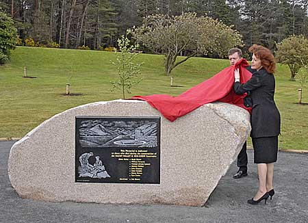 Katherine Bryan, CEO of Water Service unveils the new plaque in the Silent Valley