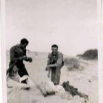 Bidwell getting ready for a bath on the beach at Tobruk.