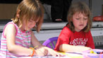 Two children colouring in