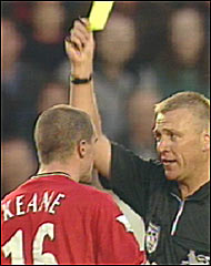 Roy Keane is given a yellow card
