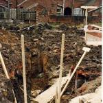 Excavated trench for building revealing unexploded bomb