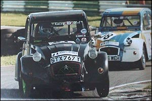 Christine driving her 2CV in a race