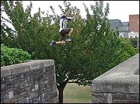 Young man jumping over gap