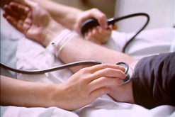 A person has their blood pressure taken