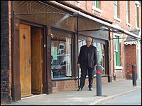 John outside the House of Magic