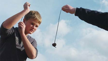 School boys playing conkers