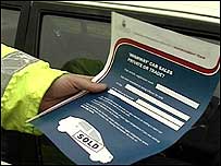 Man with car sales form