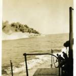 HMS Wessex laying a smokescreen on exercises, Trincomalee, October 1944