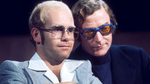 Elton John and Michael Caine on the chat show 'Parkinson', February 1976.