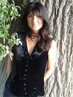 Emma Restall-Orr in front of an oak tree