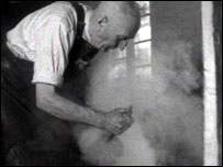 Blacksmith shoeing horse