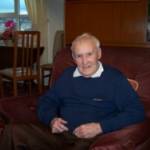 Steve Ferguson relaxing at home. Between 1939 and 1941 Steve was a coalminer at William Pit, Whitehaven. After a pit explosion 1941 Steve served with the RAF, returning to work at William Pit in 1945.