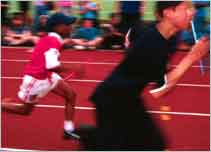 Children running a race on sports day