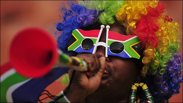 A fan blows a vuvuzela
