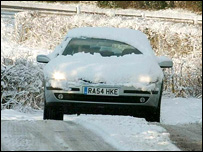 A car driving through heavy snow