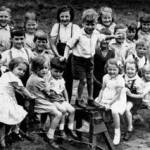 This is my fourth birthday party which was thrown for me by the Howells family in Manchester 3rd September 1943. Would be pleased to contact anyone in the picture who can recognise themself.