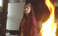 Kirsty fans the flames in the shed.