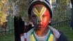 A boy with his face painted 