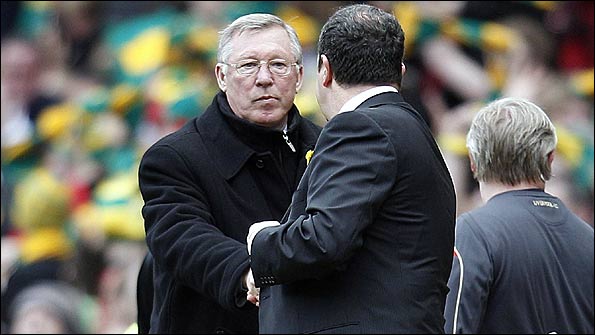 Sir Alex Ferguson (facing camera) and Rafa Benitez shake hands at the end of the match