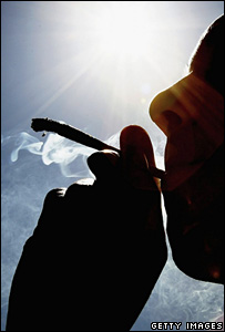 Man smoking a cannabis joint