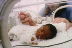 Image: baby in hospital cot