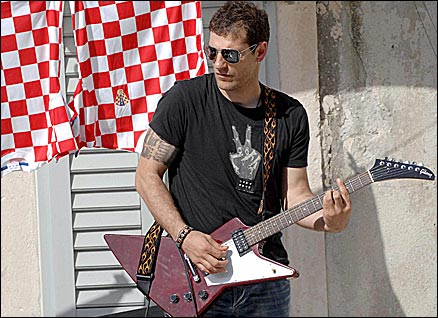 Slaven Bilic plays guitar