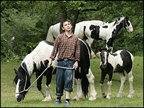 A boy with horses at Appleby Horse Fair