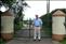 Pat outside his home